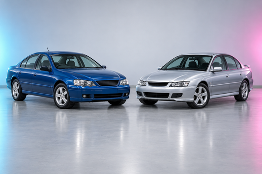 BA Ford Falcon and VY Holden Commodore parked at opposing three-quarter angles