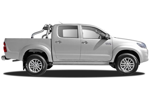 Side view of a white pickup truck on a white background